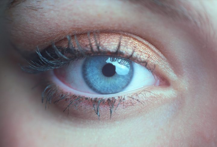 macro-photo-beautiful-blue-green-eye-woman-with-wing-eyeliner